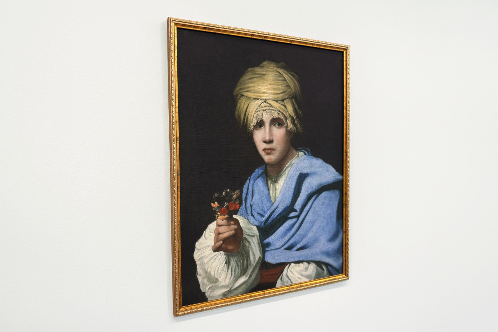 Junge mit Turban hält einen Blumenstrauß - Michiel Sweerts