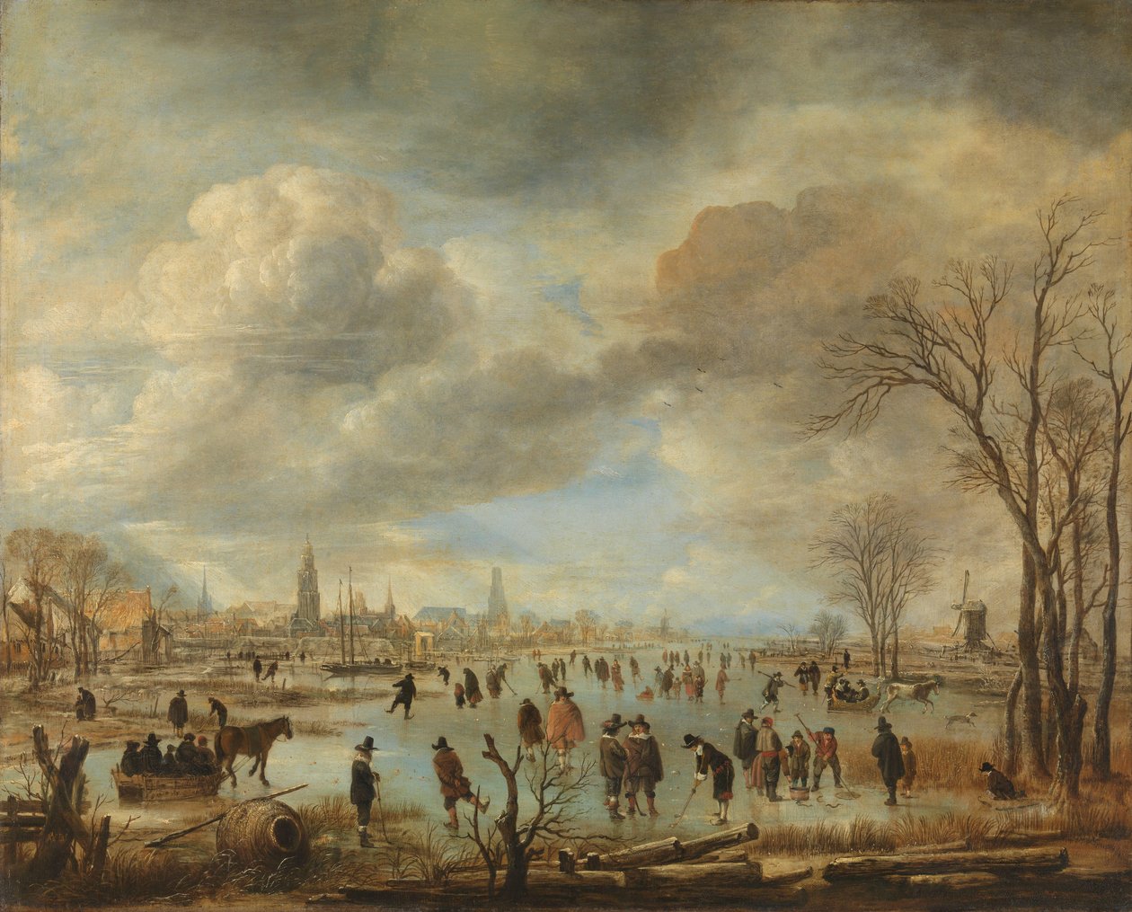 Winterlandschaft in der Nähe einer Stadt mit Kolfspielern und Pferdeschlitten von Aert van der Neer