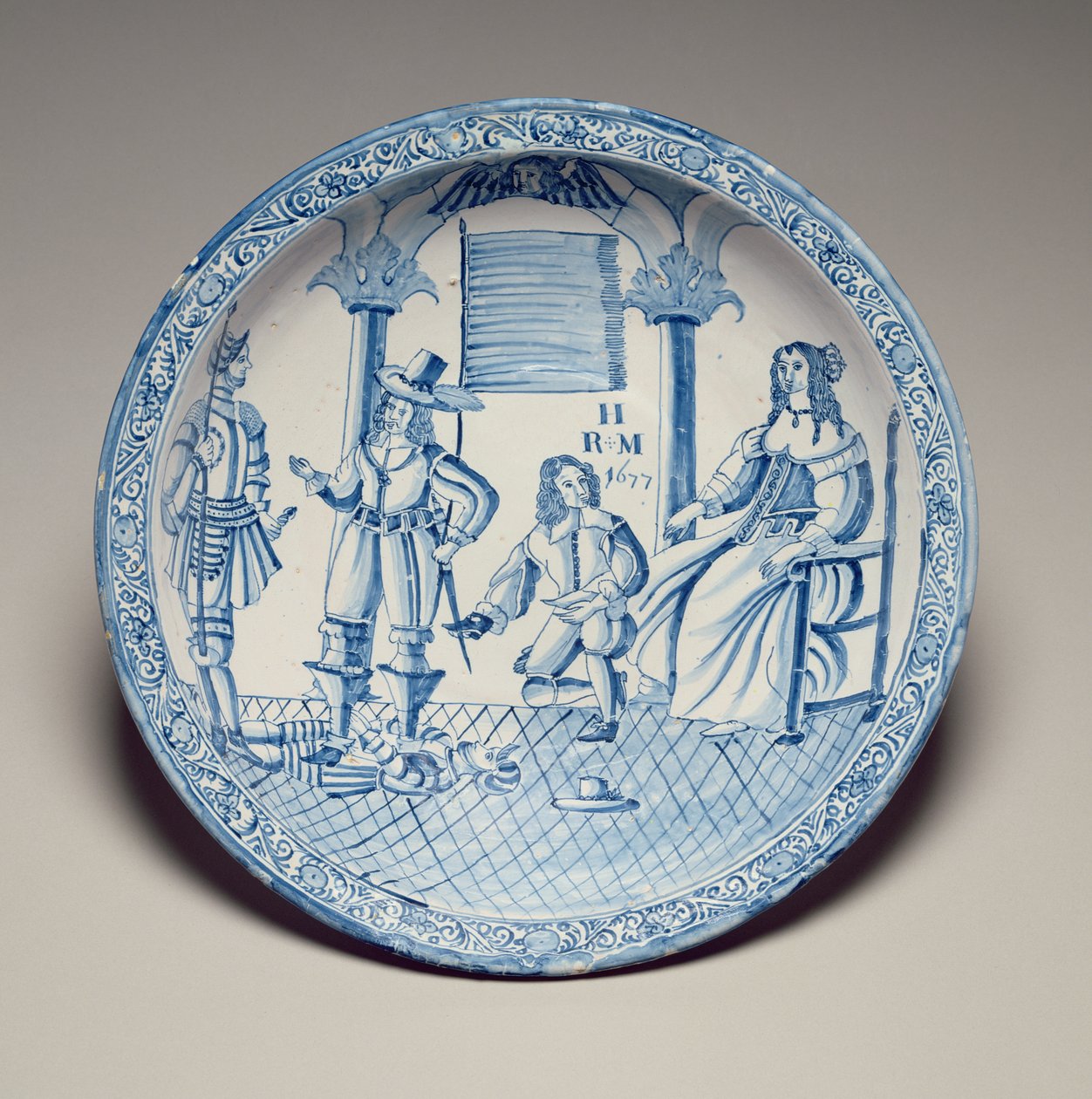 Schale mit Königin Katharina, die von einem knienden Kavalier einen Schuh angepasst bekommt, 1677 (zinnverglaste Irdenware) von English School
