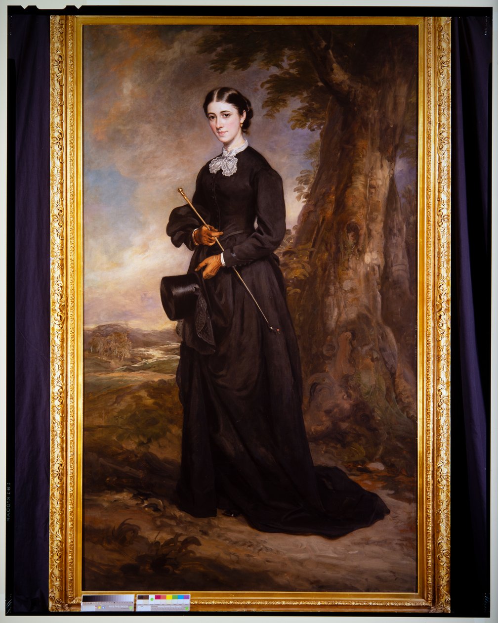 Porträt einer Dame in einem schwarzen Reitkleid, stehend in einer Landschaft von Francis Grant
