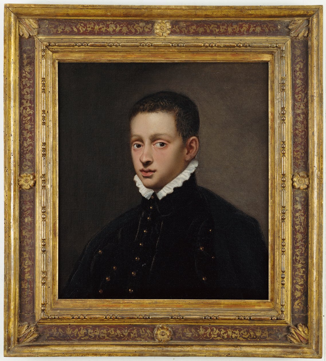 Porträt eines Jungen, Brustbild, in einem schwarzen Wams mit weißem Kragen von Jacopo Robusti Tintoretto