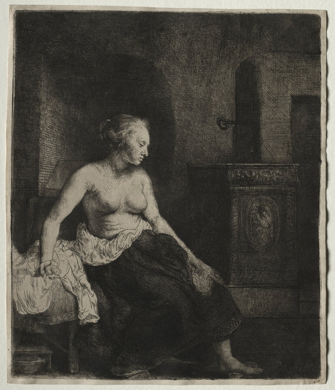 Frau sitzt halb angezogen neben einem Ofen, 1658 von Rembrandt van Rijn