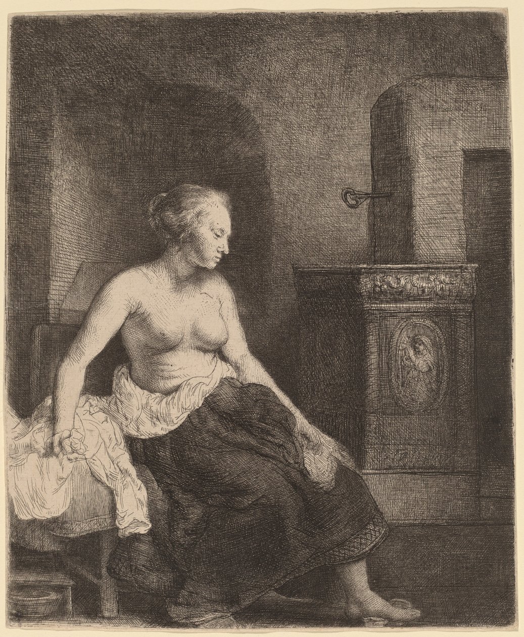 Frau sitzt halb angezogen neben einem Ofen von Rembrandt van Rijn