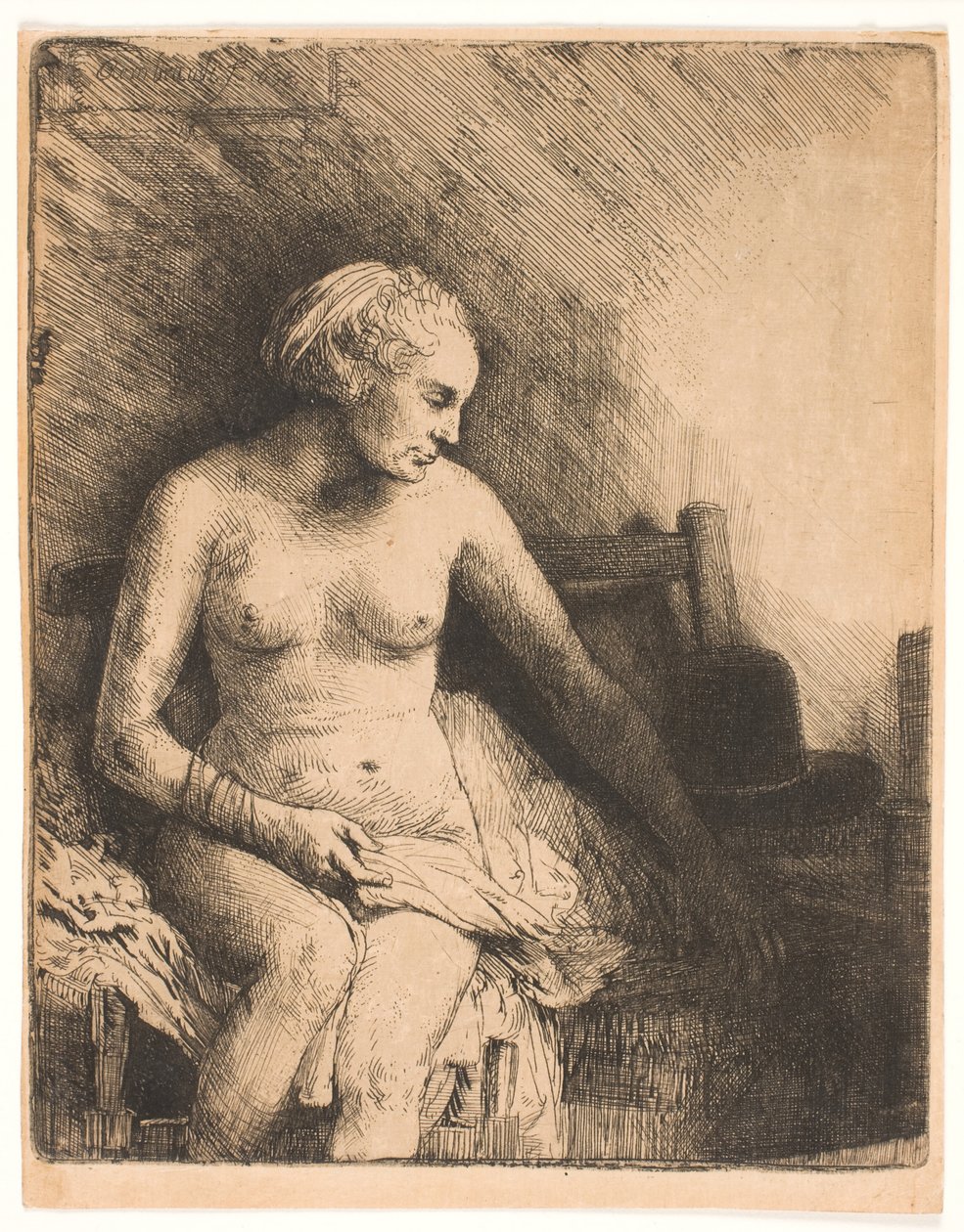 Frau beim Bad, mit einem Hut neben ihr von Rembrandt van Rijn