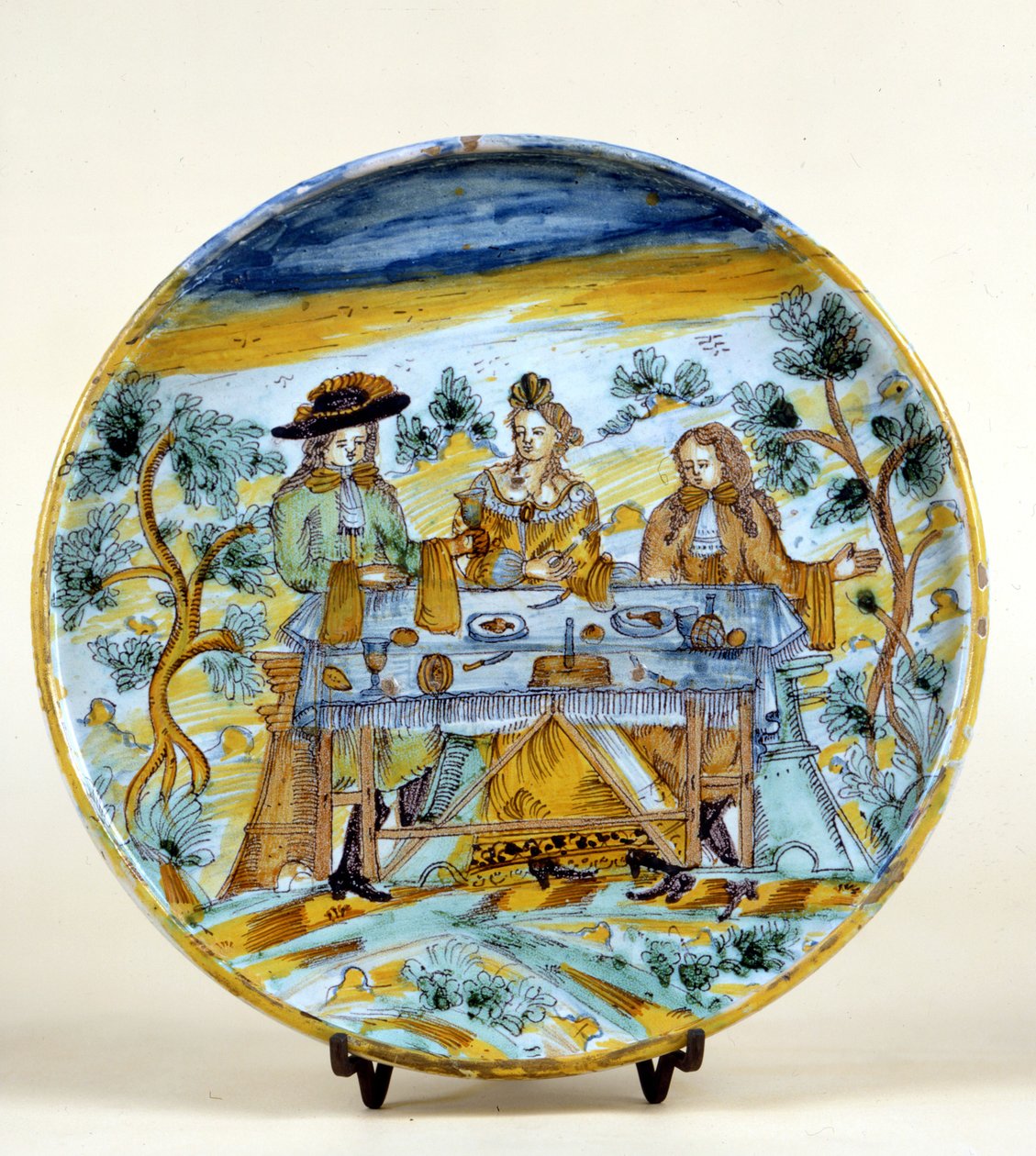 Darstellung eines Banketts im Freien auf einem Keramikteller von Talavera de la Reina (Spanien). Frühes 16. Jahrhundert. Mailand, Museo del Castello. von Spanish School