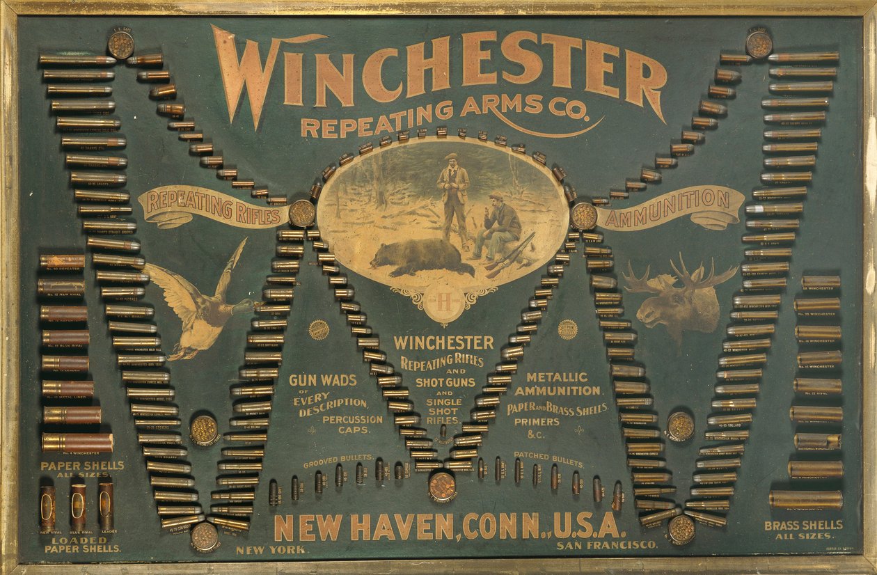 Ein Winchester-Patronen-Display-Board, mit einer umfassenden Auswahl an Metall-, Messing- und Papierhülsen-Gewehr- und Schrotpatronen, angeordnet in Form eines erweiterten "W" von Unbekannt