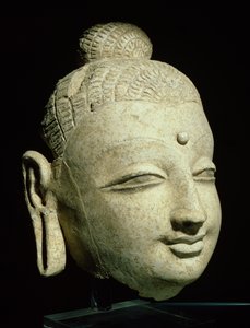 Kopf eines lächelnden Buddha, griechisch-buddhistischer Stil, aus Afghanistan, 1.-4. Jahrhundert