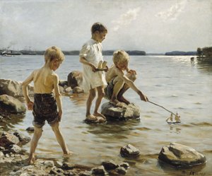 Jungen spielen am Ufer