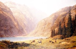 Eine bergige Seelandschaft mit Vieh