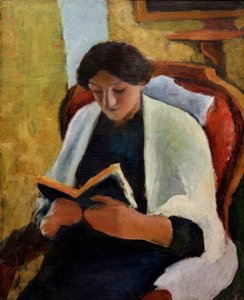Lesende Frau im roten Sessel