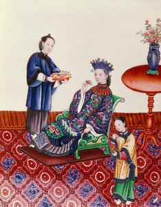 Elegante chinesische Dame riecht an einer Blume