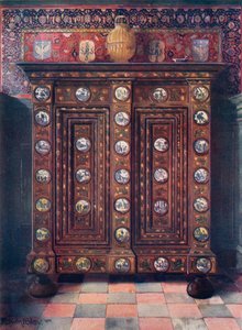 Walnuss-Kas mit eingelegten und bemalten Medaillons von Delfter Ware