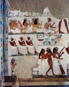 Eine Sklavin hilft weiblichen Gästen, während andere Früchte austauschen