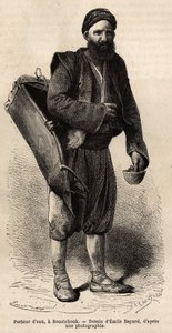Ein Wasserträger, wandernder Händler, posiert mit seiner Ausrüstung, einer Art Tankbox und einem Behälter, der als Maß und Becher dient, in Roustchouk (Rumänien), Gravur nach einer Zeichnung von Emile Bayard, illustriert die Reise nach Bulgarien, von Guill von Emile Antoine Bayard