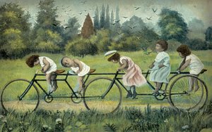 Kinder auf einem vierrädrigen Fahrrad