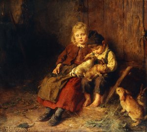 Zwei Kinder spielen mit Kaninchen