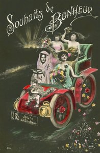 Frauen werfen Blumen aus einem Auto von French Photographer