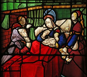 Fenster w17, Darstellung des Lebens von St. Remi. Der Einsiedler Montan wird durch die von dem Heiligen auf seine Augen aufgetragene Milch wundersam geheilt