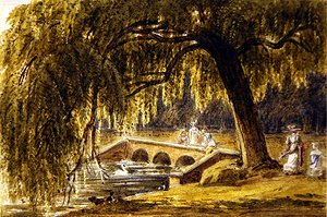 Frauen und Kinder an einer Zierbrücke in einem Park
