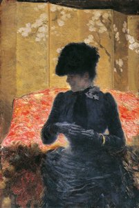 Frau auf rotem Sofa