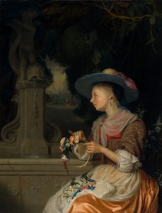 Frau, die eine Blumenkrone flicht