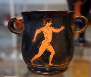 Antike griechische rote auf schwarzer Tasse, die einen Athleten darstellt von Greek School