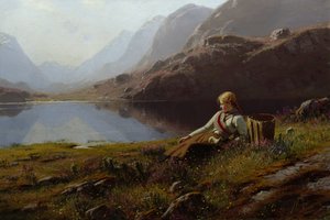 Mädchen strickt am Bergsee