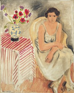 Frau auf einem Stuhl - Blumen auf dem Tisch, oder Nelken von Henri Matisse