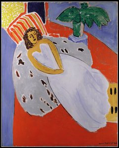 Junge Frau in Weiß, roter Hintergrund von Henri Matisse
