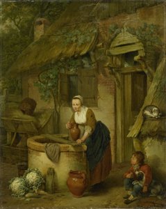 Frau, die Wasser aus einem Brunnen schöpft