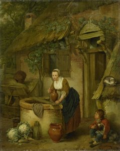 Frau, die Wasser aus einem Brunnen schöpft