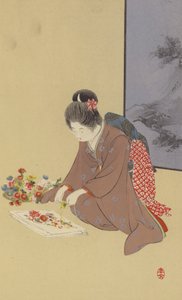 Ein junges Mädchen spielt mit Chrysanthemen