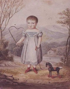 Mädchen mit einem Spielzeugpferd