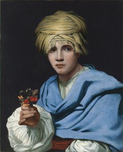 Junge mit Turban hält einen Blumenstrauß