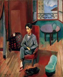 Jean Cocteau sitzt in seinem Atelier