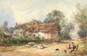 Ein strohgedecktes Cottage an einem Weg