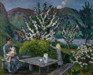Mutter und Kind am Gartentisch