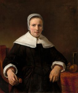 Eine Frau, die eine Nelke hält von Rembrandt van Rijn