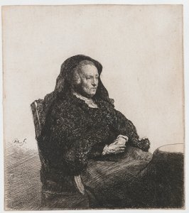 Die Mutter des Künstlers sitzt an einem Tisch und schaut nach rechts: Dreiviertelansicht von Rembrandt van Rijn