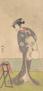 Der erste Nakamura Tomijuro als Oiran in einem Raum stehend von Shunsho