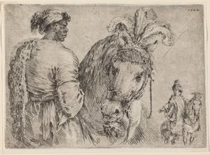 Ein Schwarzer füttert ein Pferd