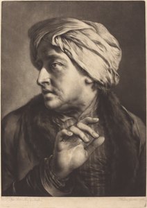 Ein Mann mit Turban und gestreiftem Hemd