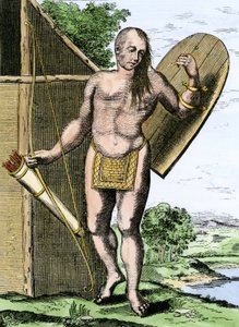 Geschichte der indigenen Völker: Ein Indianer aus Kanada mit einem Schild, einem Bogen und Pfeilen in einem Köcher