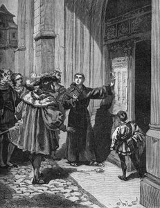 Martin Luther (1483-1546) hängt seine 95 Thesen in Wittenberg auf