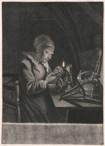 Eine alte Frau repariert ihr Spinnrad