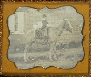 Junge mit Hut auf einem Pferd von Unknown artist