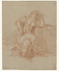 Sitzende Frau in lasziver Pose