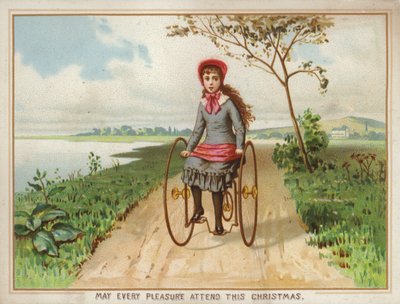 Mädchen fährt Dreirad auf dem Land von American School