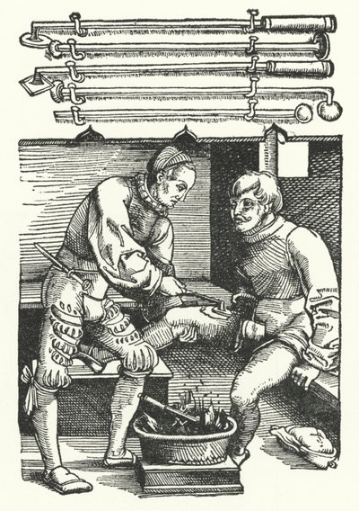 Ein Chirurg kauterisiert die Beinwunde eines Soldaten von German School