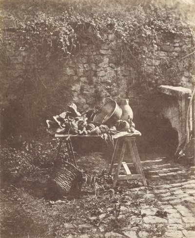 Stillleben: Kessel, Krug und Gemüse auf einem Tisch mit Böcken von Henri Victor Regnault